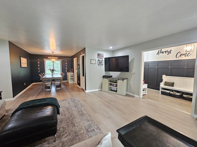 living area with wood finished floors and baseboards