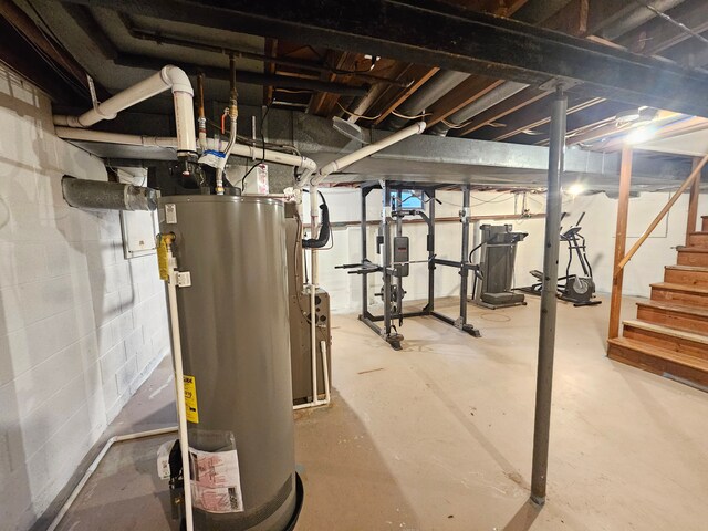 unfinished below grade area with water heater and stairs