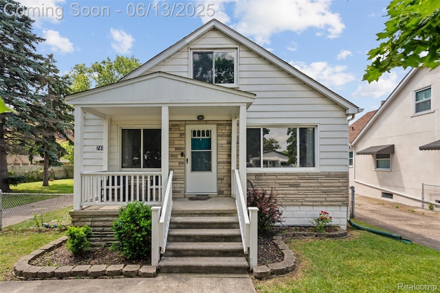 7416 Gerald Ave, Warren, MI 48092 - bungalow-style home with covered porch and stone siding