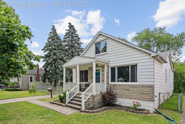 7416 Gerald Ave, Warren, MI 48092 - bungalow-style home with stone siding and a porch