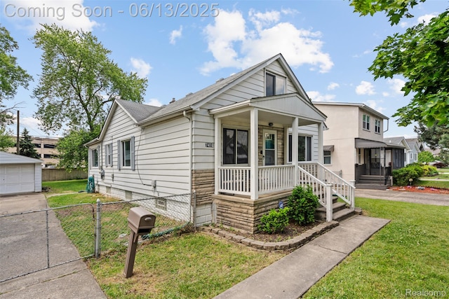 7416 Gerald Ave, Warren, MI 48092 - view of front of house featuring a porch, an outbuilding, and a shingled roof