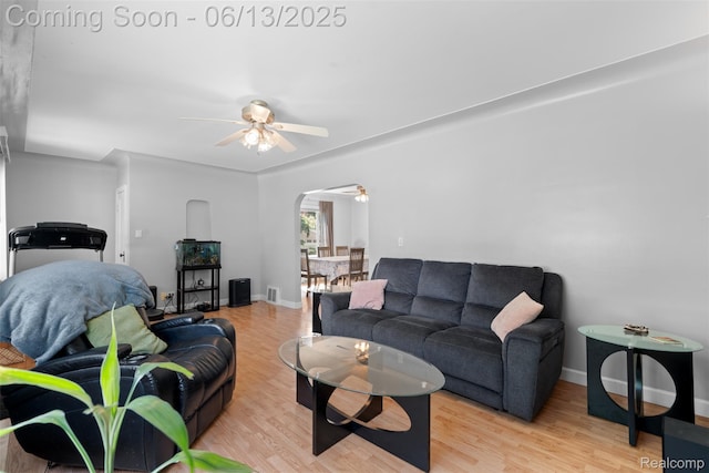 7416 Gerald Ave, Warren, MI 48092 - living area featuring a ceiling fan, arched walkways, and wood finished floors