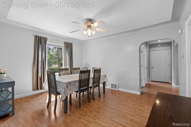 7416 Gerald Ave, Warren, MI 48092 - dining space with arched walkways, a ceiling fan, and light wood finished floors