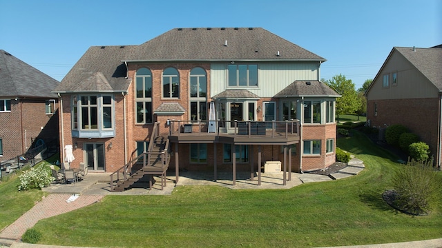 54545 Pelican Ln, Shelby Twp, MI 48315 - back of house featuring a patio area, brick siding, stairs, a yard, and roof with shingles