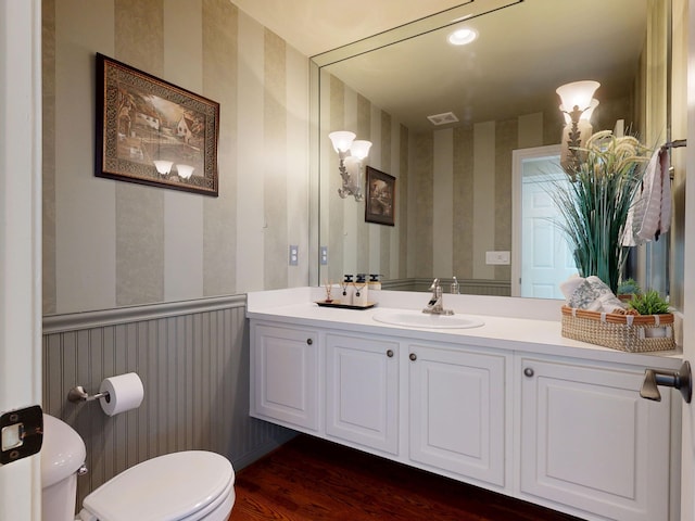 54545 Pelican Ln, Shelby Twp, MI 48315 - half bath featuring wallpapered walls, toilet, vanity, and wood finished floors