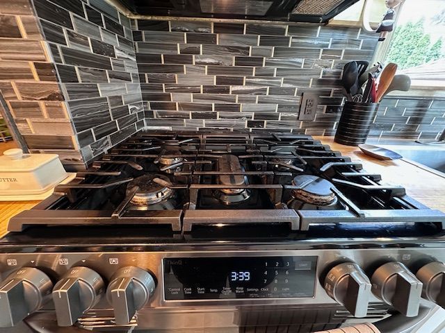 95 Mapleton Rd, Grosse Pointe Farms, MI 48236 - kitchen view of stainless steel gas range and backsplash