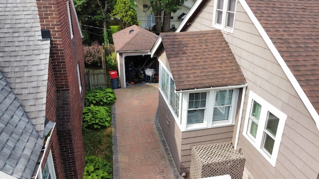 95 Mapleton Rd, Grosse Pointe Farms, MI 48236 - view of property exterior featuring roof with shingles and fence