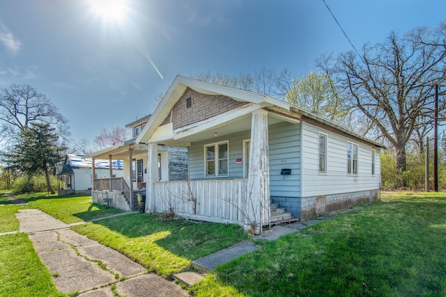 975 Fernhill St, Highland Park, MI 48203 - view of front of home featuring a porch and a front yard