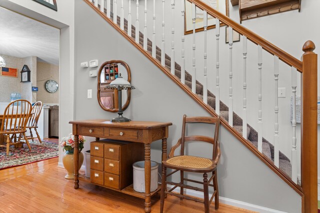 336 Jonesville Rd, Jonesville, MI 49250 - stairs with wood finished floors and baseboards