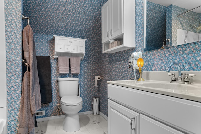 336 Jonesville Rd, Jonesville, MI 49250 - bathroom featuring tile patterned flooring, toilet, a shower, vanity, and baseboards