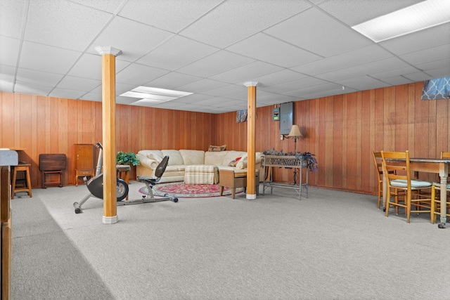 336 Jonesville Rd, Jonesville, MI 49250 - living area with carpet flooring, a drop ceiling, electric panel, and wooden walls