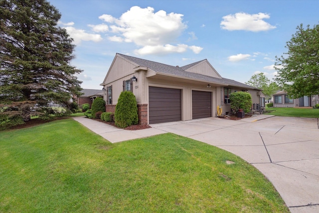 11928 Shenandoah Unit 3, South Lyon, MI 48178 - view of side of property featuring a garage, driveway, a lawn, and brick siding