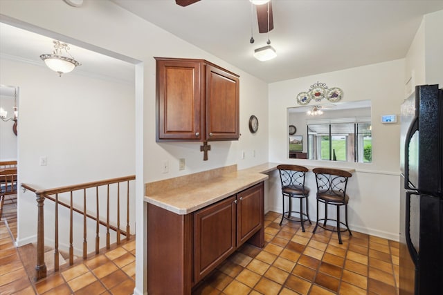 11928 Shenandoah Unit 3, South Lyon, MI 48178 - kitchen featuring freestanding refrigerator, a ceiling fan, light countertops, and baseboards