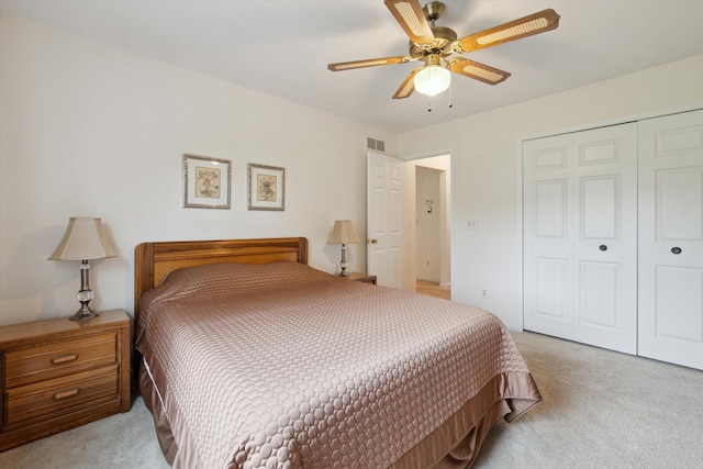 11928 Shenandoah Unit 3, South Lyon, MI 48178 - bedroom with light carpet, a closet, and ceiling fan
