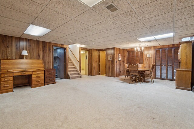 11928 Shenandoah Unit 3, South Lyon, MI 48178 - finished basement with wood walls, stairway, carpet, and a paneled ceiling