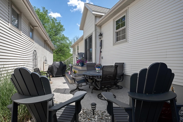 416 Enclave Ct SE Unit 2, Grand Rapids, MI 49546 - view of patio / terrace with area for grilling and outdoor dining area