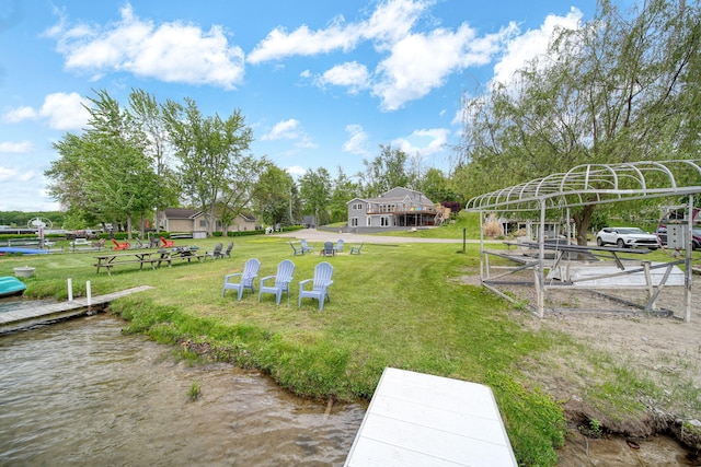 282 Evans Trl, Tipton, MI 49287 - view of grassy yard featuring a water view
