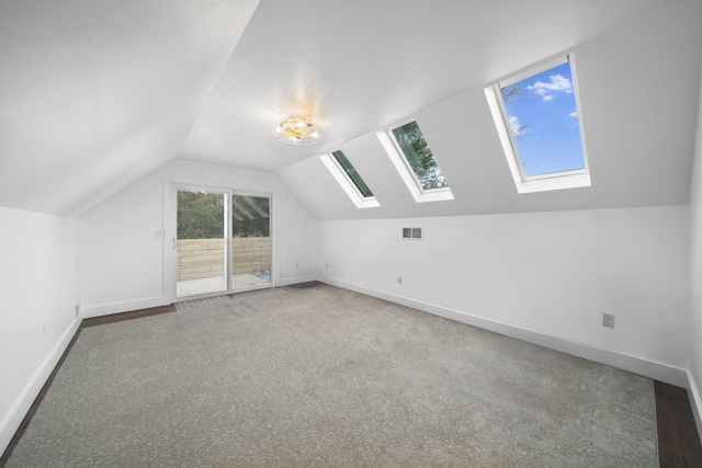 282 Evans Trl, Tipton, MI 49287 - bonus room featuring a skylight, carpet flooring, baseboards, and vaulted ceiling