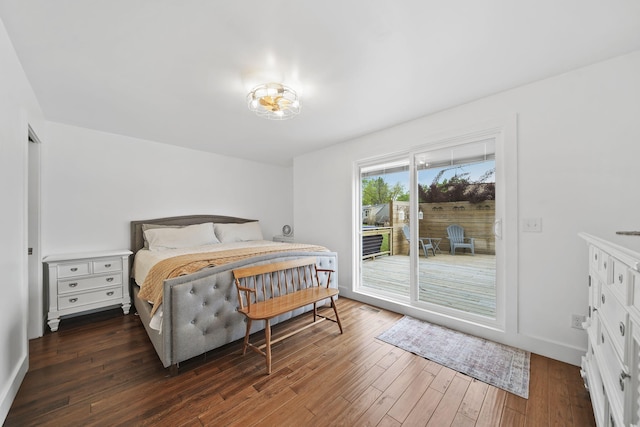 282 Evans Trl, Tipton, MI 49287 - bedroom with access to outside, dark wood-style flooring, and baseboards
