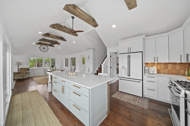 282 Evans Trl, Tipton, MI 49287 - kitchen featuring high end white fridge, gas stove, open floor plan, light countertops, and white cabinets