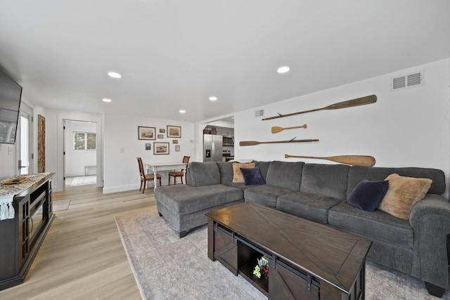 282 Evans Trl, Tipton, MI 49287 - living room with light wood-style floors, recessed lighting, and baseboards