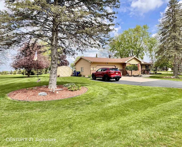 2880 Wurtzel Dr, Freeland, MI 48623 - view of front of home featuring driveway, a garage, and a front yard