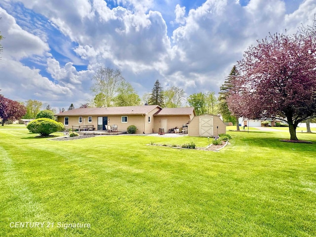 2880 Wurtzel Dr, Freeland, MI 48623 - back of house featuring a storage unit, an outbuilding, a lawn, and a patio area