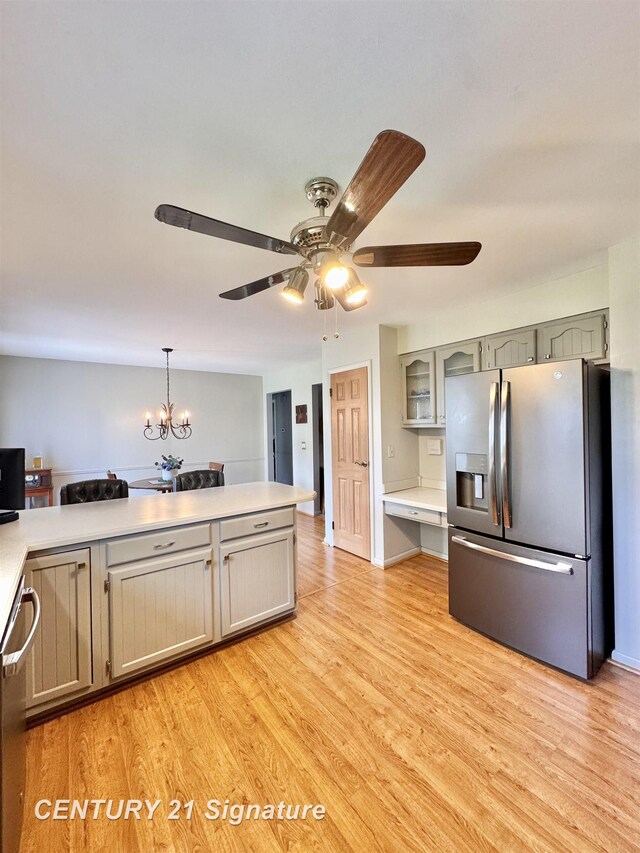 2880 Wurtzel Dr, Freeland, MI 48623 - kitchen featuring appliances with stainless steel finishes, ceiling fan, light countertops, and light wood-style flooring