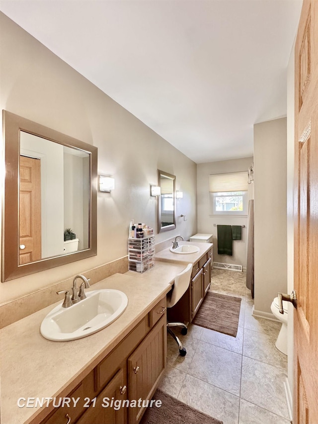 2880 Wurtzel Dr, Freeland, MI 48623 - bathroom featuring double vanity, toilet, and tile patterned floors