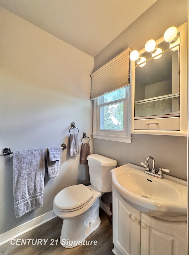 2880 Wurtzel Dr, Freeland, MI 48623 - full bathroom with baseboards, toilet, wood finished floors, vanity, and a shower