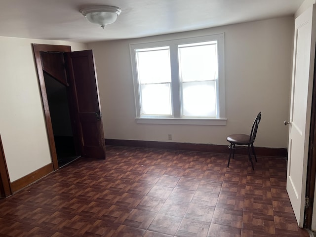 unfurnished bedroom with baseboards