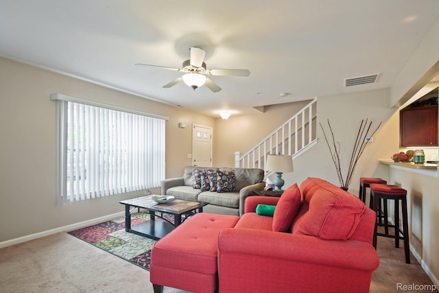 781 2nd St Unit 61, Wyandotte, MI 48192 - living area featuring carpet floors, a ceiling fan, stairs, and baseboards