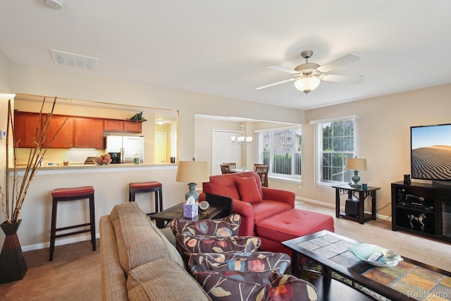 781 2nd St Unit 61, Wyandotte, MI 48192 - living room featuring light carpet, a chandelier, ceiling fan, and baseboards