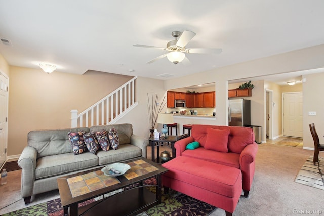 781 2nd St Unit 61, Wyandotte, MI 48192 - living area featuring light colored carpet, stairway, ceiling fan, and baseboards