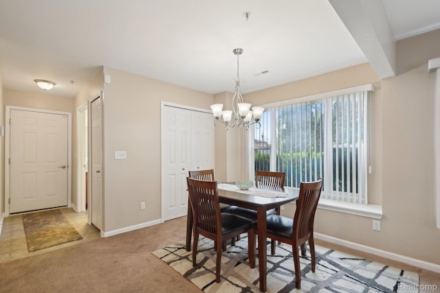 781 2nd St Unit 61, Wyandotte, MI 48192 - dining space with baseboards, a chandelier, and carpet floors