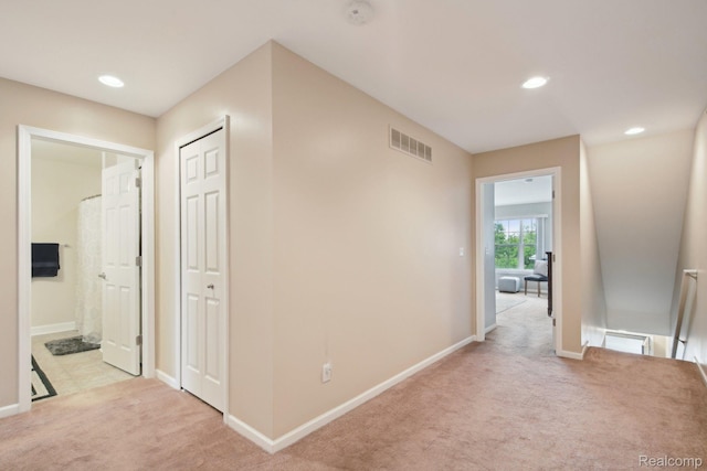 781 2nd St Unit 61, Wyandotte, MI 48192 - corridor featuring light carpet, baseboards, an upstairs landing, and recessed lighting