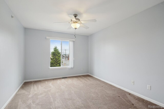 781 2nd St Unit 61, Wyandotte, MI 48192 - carpeted spare room with a ceiling fan and baseboards