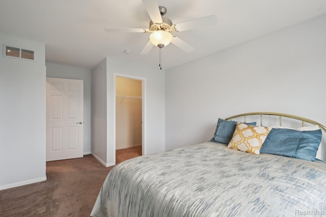 781 2nd St Unit 61, Wyandotte, MI 48192 - bedroom featuring carpet floors, baseboards, a spacious closet, ceiling fan, and a closet