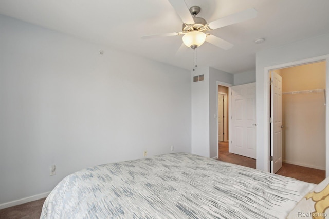 781 2nd St Unit 61, Wyandotte, MI 48192 - bedroom featuring carpet flooring, baseboards, a spacious closet, a closet, and a ceiling fan
