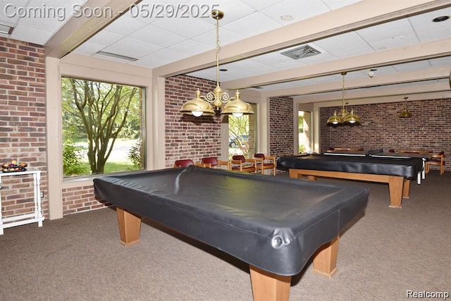 1522 Brentwood Dr, Troy, MI 48098 - recreation room featuring brick wall, healthy amount of natural light, carpet flooring, pool table, and a drop ceiling