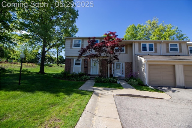1522 Brentwood Dr, Troy, MI 48098 - view of property featuring brick siding, a front lawn, an attached garage, and asphalt driveway