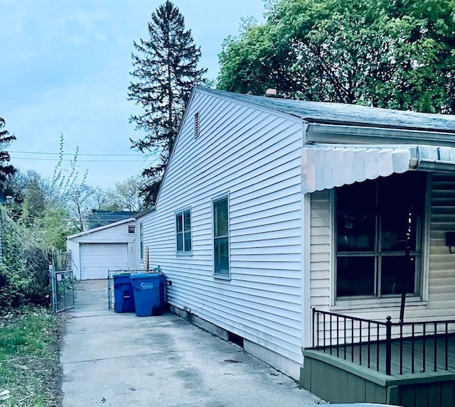 20760 Atlantic Ave, Warren, MI 48091 - view of home's exterior featuring an outbuilding and a detached garage