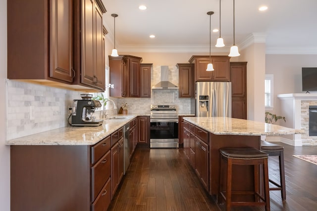 3105 Talbot, Troy, MI 48083 - kitchen with stainless steel appliances, wall chimney range hood, a sink, a kitchen island, and a breakfast bar