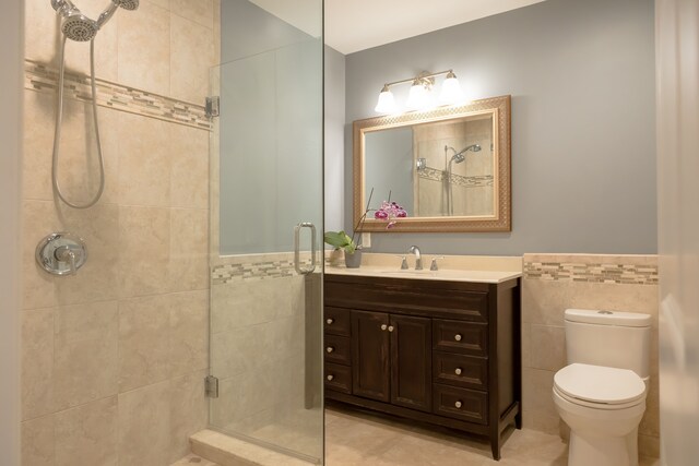 3105 Talbot, Troy, MI 48083 - full bath featuring tile walls, a stall shower, tile patterned floors, toilet, and wainscoting