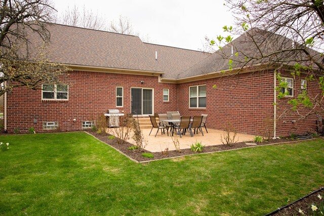 3105 Talbot, Troy, MI 48083 - back of property featuring brick siding, a shingled roof, a yard, and a patio