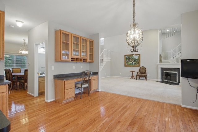 17280 Breckenridge Dr, Clinton Township, MI 48038 - kitchen with light wood-style floors, glass insert cabinets, dark countertops, and open floor plan