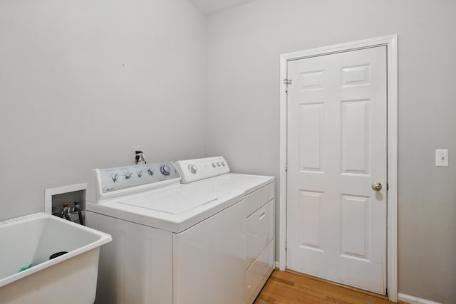 17280 Breckenridge Dr, Clinton Township, MI 48038 - clothes washing area with separate washer and dryer and light wood finished floors