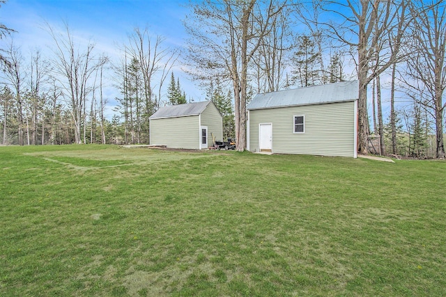19378 Hackett Lake Highway, Onaway, MI 49765 - view of grassy yard with an outbuilding