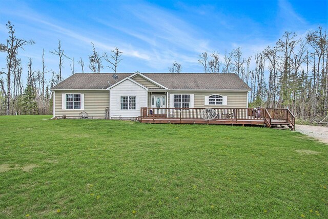 19378 Hackett Lake Highway, Onaway, MI 49765 - view of front of property featuring a deck, a front yard, and roof with shingles