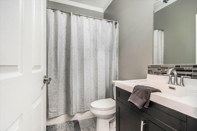 19378 Hackett Lake Highway, Onaway, MI 49765 - full bathroom with crown molding, decorative backsplash, toilet, vanity, and tile patterned flooring
